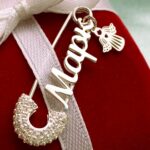 Шпилька срібна Марк з фіанітами і янголом